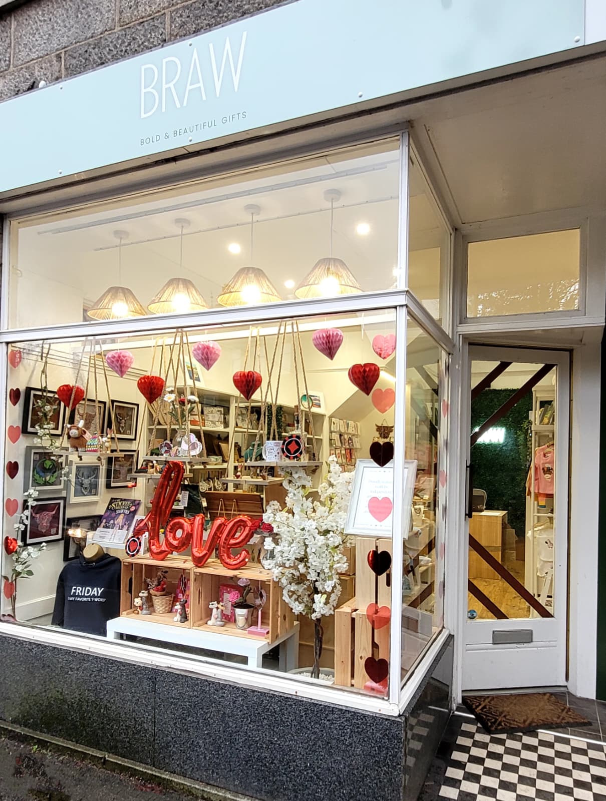 Storefront with decorative items and 'LOVE' sign